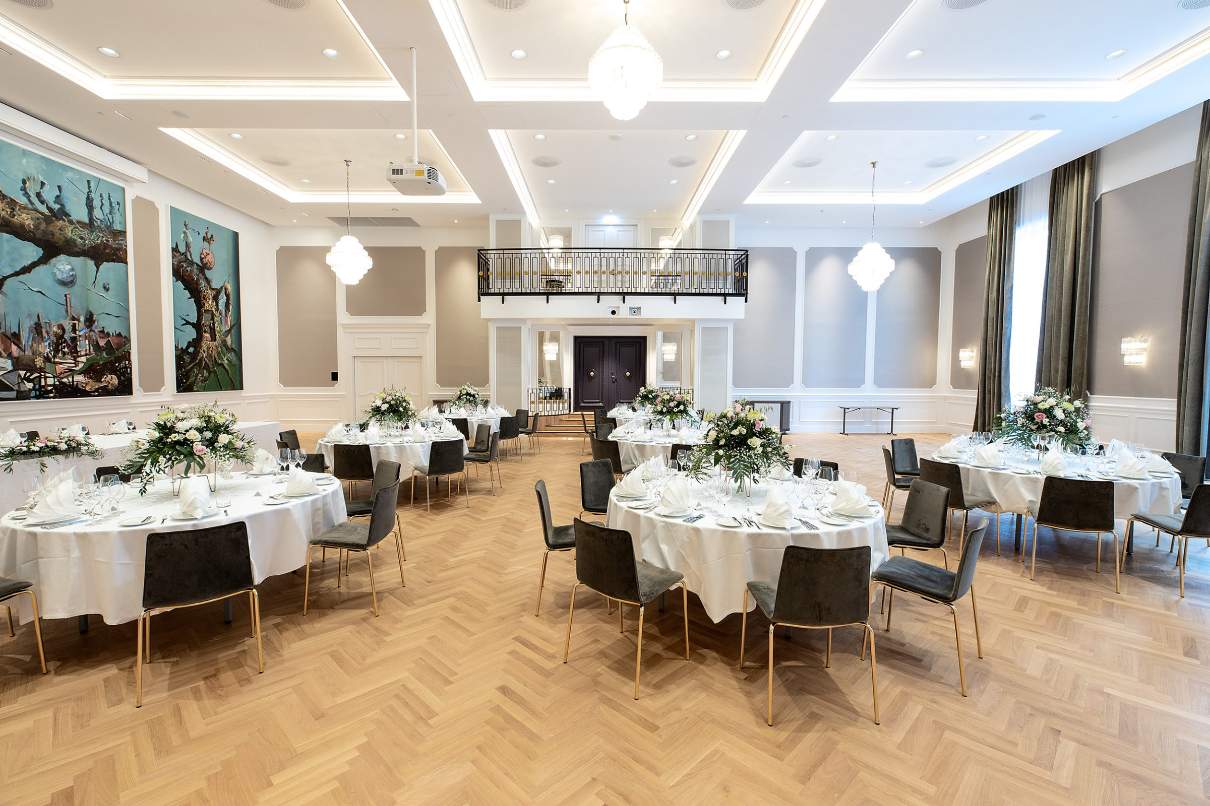 Britannia Hall with round table seating, decorated with white details for wedding venues