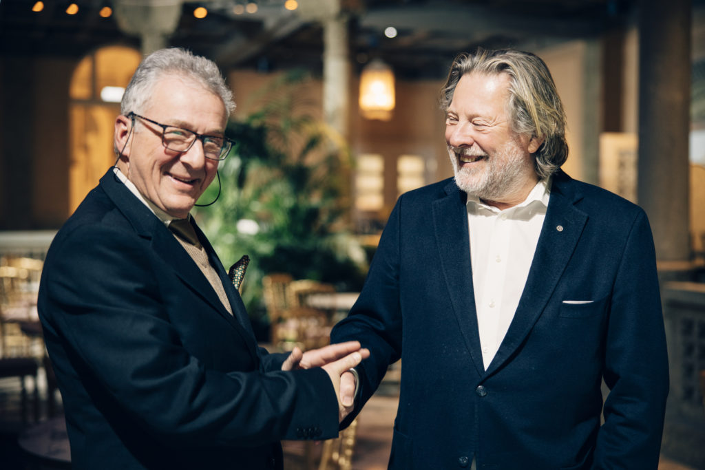 Herbert Klein, the doorman at Britannia Hotel in Trondheim, meets the hotel's owner Odd Reitan in the newly restored, historic Palmehaven.