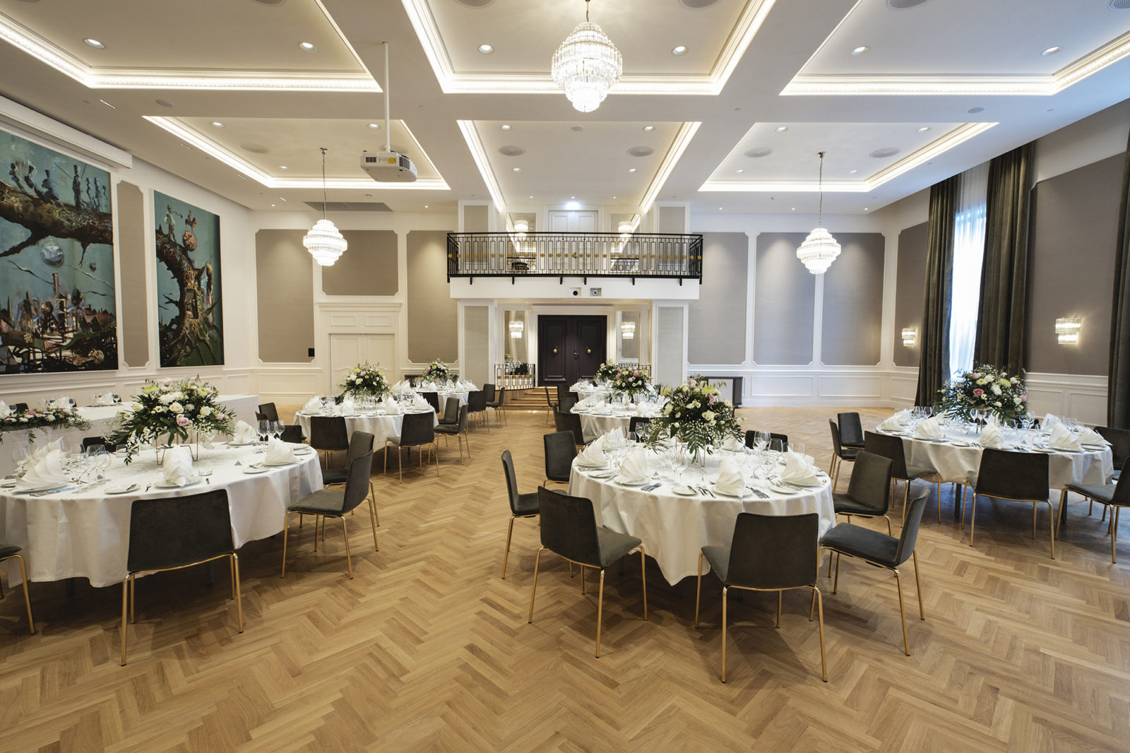 Britannia Hall with round table seating, fine details and artwork on the walls