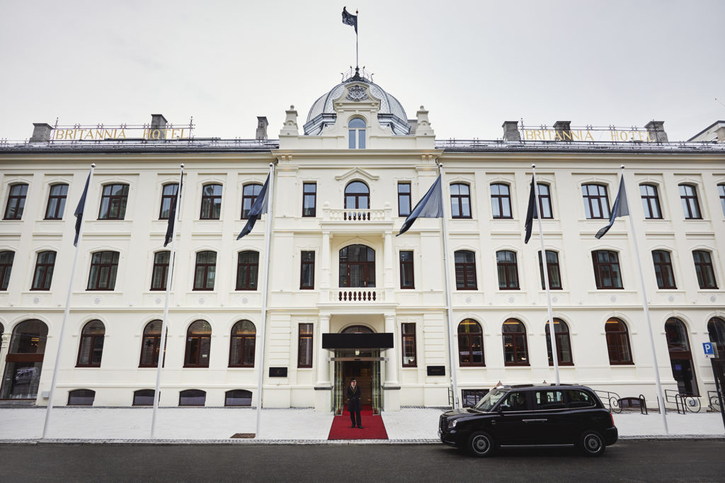 London Black Cand and doorman stood outside Britannia Hotel façade