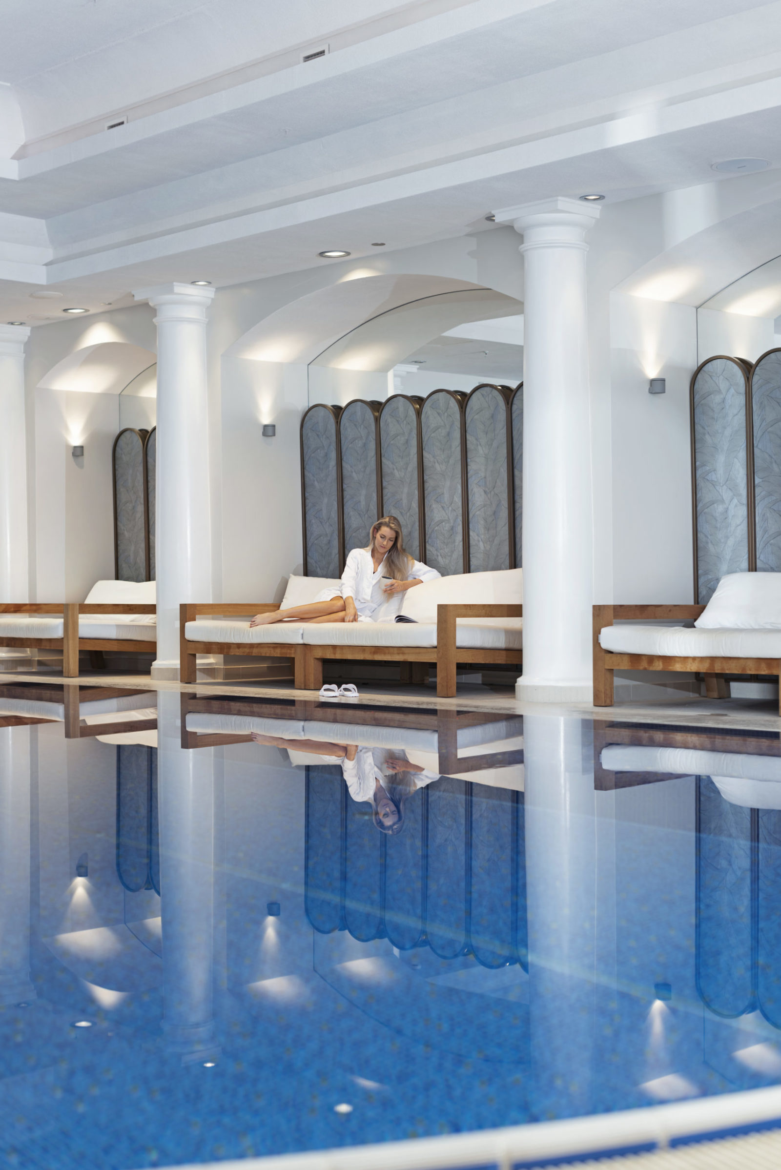 A woman relaxing in the pool area at Britannia spa in Trondheim