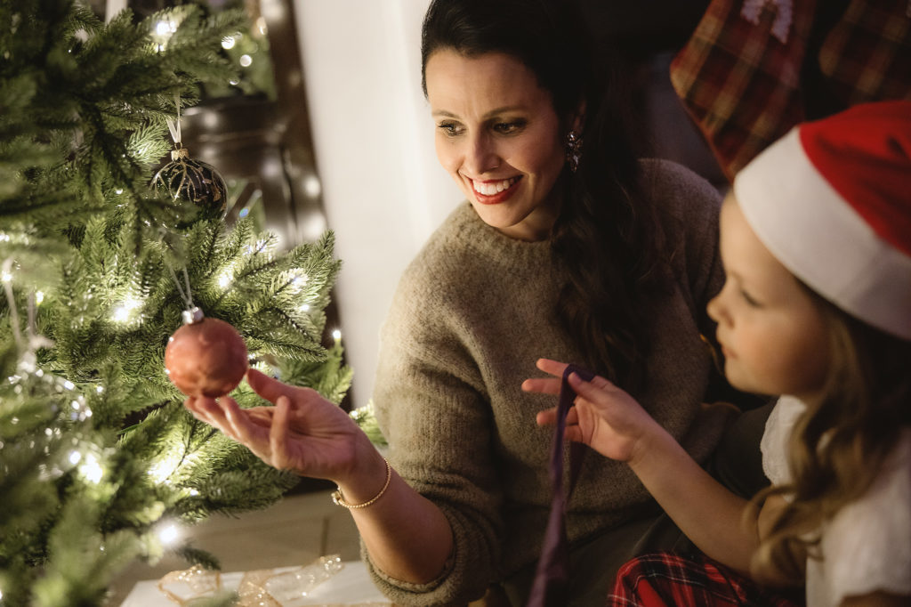 Mother and daughter looking at the christmas ornaments on the tree at Britannia Hotel