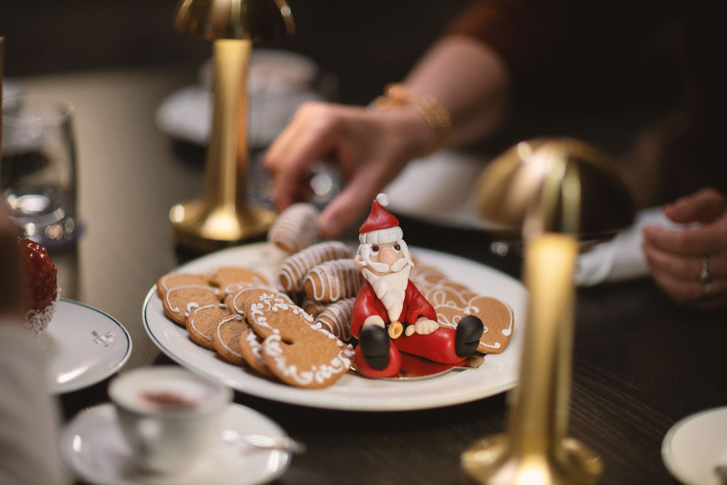 Christmas biscuits on a table with gold interior details