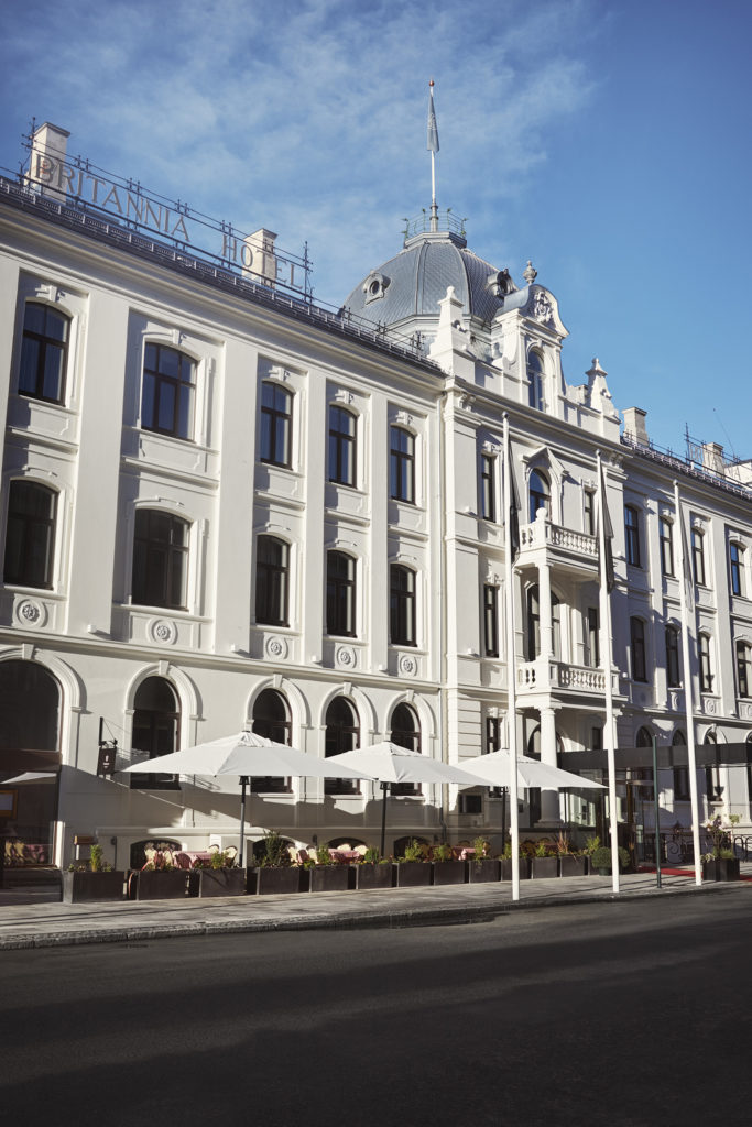 Britannia Facade in the sun, with outdoor seating outside Brasserie Britannia